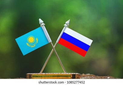 Russia and Kazakhstan small flag with blur green background - Powered by Shutterstock