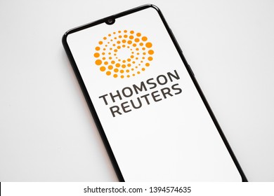 RUSSIA, KAZAN MAY 1, 2019:Thomson Reuters logo on a white background on the smartphone screen