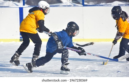 Russia, Kechevo, 12,02,2021 Playing Ice Hockey On An Outdoor Ice Rink