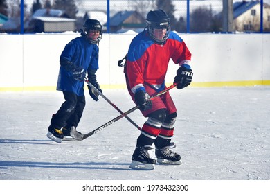 Russia, Kechevo, 12,02,2021 Playing Ice Hockey On An Outdoor Ice Rink