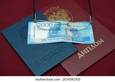 Russia, Kemerovo - 16.10.21. Russian Diplomas Of Higher Education, Money And Glasses