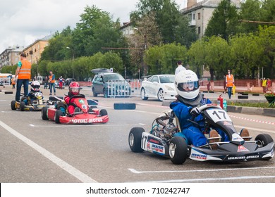 Russia, Kirov - June, 12, 2017: Car And Kart Driver During The Open Competitions In The Birthday Of City Kirov