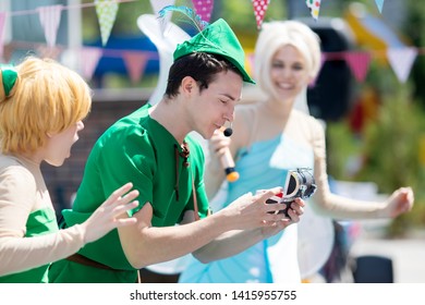 RUSSIA, KRASNODAR - MAY 31 2019: Animators Working At The Birthday Party For Little Children. Show With Animators, Dressed Like Peter Pan And Tinker Bell Fairy