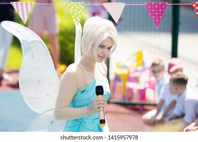 RUSSIA, KRASNODAR - MAY 31 2019: Animator Works At The Birthday Party For Little Children. Show With An Animator, Dressed In Tinker Bell Fairy Costume