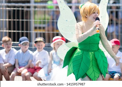 RUSSIA, KRASNODAR - MAY 31 2019: Happy Group Of Children At A Birthday Celebration Watching Show With An Animator, Dressed In Tinker Bell Fairy Costume