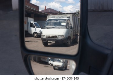 Russia, Krasnodar Region, Krasnodar, 15.05.2020 Cars In The Reflection Of The Rearview Mirror.