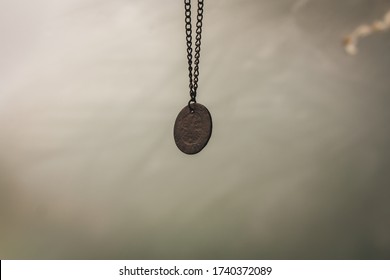 Russia. Krasnodar Region. Krasnodar. 3.05.2020. An Old Russian Copper Coin Hung On A Chain On The Rearview Mirror In A Car