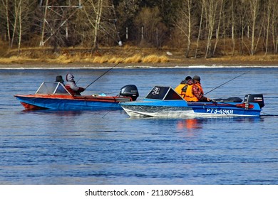 Russia Krasnoyarsk - March 29, 2015 Two Motor Boats With Yamaha Motors By Fishermen On The Yenisei River Are Fishing