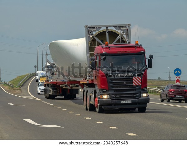 Russia ,
Maikop - June 4, 2019: Heavy-duty car and unusual cargo (an element
of urban sculpture) on the
highway