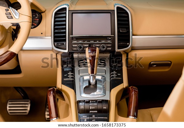 Russia, Makhachkala - January 24, 2020: Dashboard of\
the Porsche Cayenne. The screen of multimedia system. Panel of a\
modern car. \
