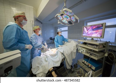 RUSSIA, MOSCOW - 01 SEP, 2015: Three people are removing trumor at the center of endosurgery and lithotripsy.