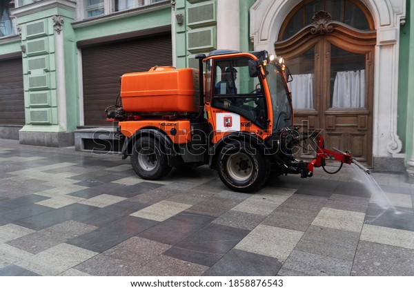 Russia, Moscow, 01.11.2020 G. A utility car washes
the sidewalk in the
city