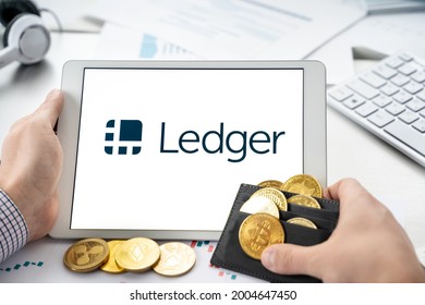 Russia Moscow 06.05.2021.Tablet With Logo Of Ledger Hardware Pocket Wallet. Safe, Secure Vault For Cryptocurrency,coins,tokens,nft Digital Assets.Storage For Bitcoins,litecoins,passwords,logins,keys.