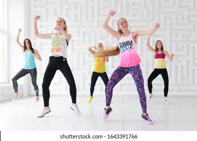 RUSSIA, MOSCOW, 2017 - MARCH 12: Group of young women in sportswear at Zumba dance fitness class in white Zumba studio