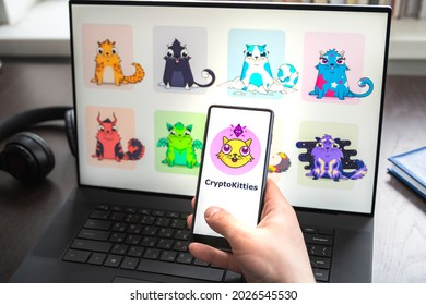 Russia Moscow 30.05.2021.Logo, Screenshot Of Blockchain Nft Ethereum Cryptocurrency Game Cryptokitties In Laptop Screen. Man Playing, Collecting Crypto Kitties. Earning Digital Money At Home.