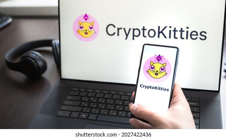 Russia Moscow 30.05.2021.Logo, Screenshot Of Blockchain Nft Ethereum Cryptocurrency Game Cryptokitties In Laptop Screen. Man Playing, Collecting Crypto Kitties. Earning Digital Money At Home.