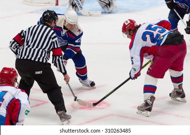 RUSSIA, MOSCOW - APRIL 27, 2015: M. Salimov (25, B) and V. Zelepukin(25, R) on faceoff on hockey game CSKA vs SKA teams on Hockey Cup of Legends in Ice Palace VTB, Moscow, Russia