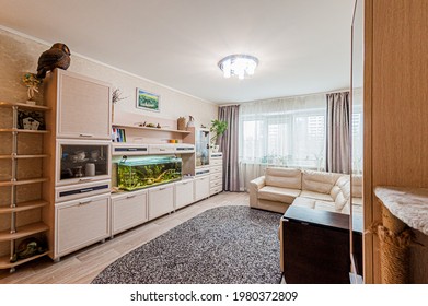 Russia, Moscow- April 28, 2020: interior room apartment bright cozy atmosphere. general cleaning, home decoration, preparation of house for sale. living room with sofa. lamp chandelier on the ceiling - Shutterstock ID 1980372809