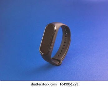 Russia Moscow January 29, 2020 mi band 4 black color stand on a blue background