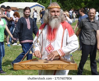 Russia, Moscow, June 23, 2013 - Old Slavic Man Plays The Gusli