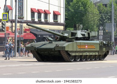 Russia, Moscow - June 24, 2020: Moscow Victory Day Parade. T-14 Armata Battle Tank Drives Down Krasnaya Presnya Street Next To The Moscow Zoo.