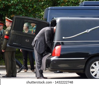 Russia, Moscow, May 31, 2013 - The Driver Of The Hearse Inspects The Compartment For The Coffin