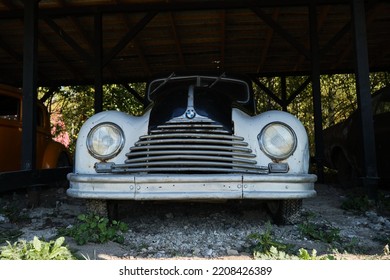 Russia, Moscow - September 2022. Old Retro Vintage Black And White BMW Of 20th Century Stands Outside At Car Show. Front View. Round Headlights.