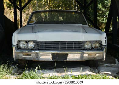 Russia, Moscow - September 2022. Old Retro Vintage White American Sports Car Of 20th Century Stands Outside At Car Show. Front View. Chrome Shiny Bumper.