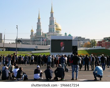 Russia, Moscow, September 23, 2015 - People Watch, On The Big Screen, A Broadcast Of The Speech Of Russian President Vladimir Putin, At The Opening Ceremony Of The Moscow Cathedral Mosque 