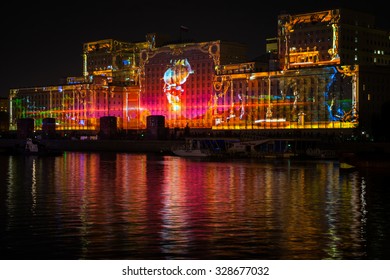 Russia. Moscow - September 26, 2015. The opening of the Festival Circle Of Light. Gorkiy Park. The complex of buildings of the Ministry of Defense and the Andreevskiy Bridge during the Show. - Shutterstock ID 328677032