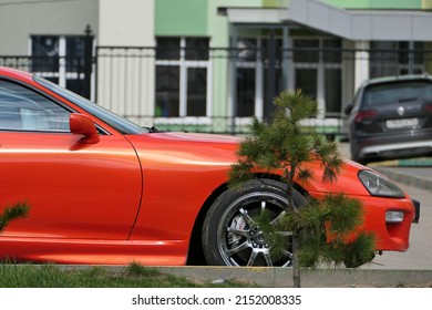 Russia, Nizhny Novgorod, Gagarin Avenue 101, 04.28.2022. Red Car In The Parking Lot In The Courtyard Of A Modern Residential Complex.