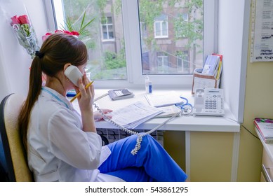 Russia, Nizhny Tagil: July 17, 2014. Maternity Hospital, Doctors And Nurses Neonatologists. Nurse Talking With Patient Over The Phone.