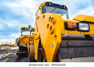 Russia, Novokuzneck, 20.05.2018: Laying asphalt into the city with a roller - Shutterstock ID 1095623105