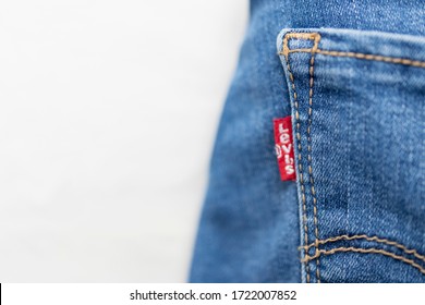 Russia, Omsk. 2020.04.28. Levis Jeans Close-up. Red Levi's Strauss Logo On The Back Pocket