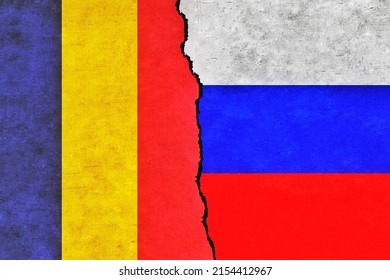 Russia and Romania painted flags on a wall with a crack. Russia and Romania conflict. Romania and Russia flags together