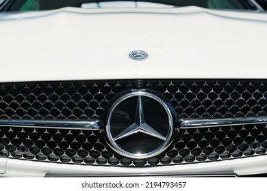 Russia, Rostov-on-Don, 05.07.2022. Logo And Grille Radiator. Part Of A White Mercedes CLS. Sale Of Luxury Cars. Leasing And Loan For The Purchase Of A Car. Modern Technologies. 