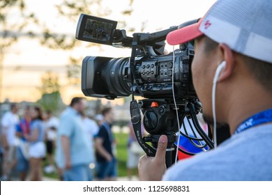 Russia, Rostov-on-Don, July 2, 2018: FIFA World Cup 2018 Videographer shoots as fans go to the stadium to watch a football match