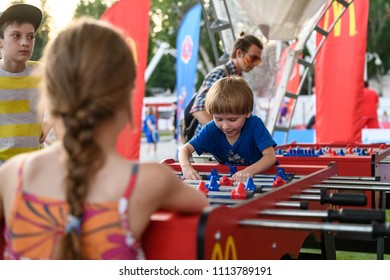 Russia, Rostov-on-Don, June 15, 2018: FIFA World Cup 2018 little boy prepare for a table football game against a girl
