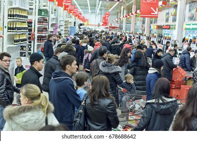 Russia saint petersburg, 17,01,2015 queue of buyers to cash desks at rush hour in supermarket Auchan