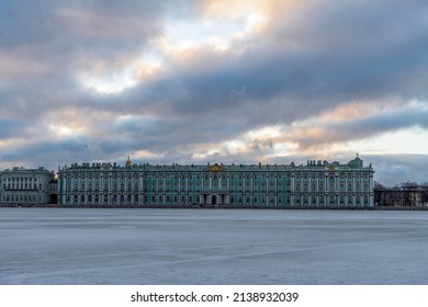 Russia, Saint Petersburg - February 26, 2022: Winter Palace Of The State Hermitage Museum In Saint Petersburg City In The Early Winter Morning. No People. Neva River Covered With Ice.