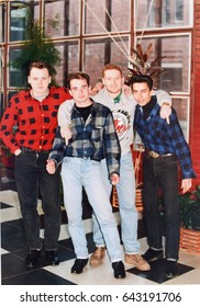 RUSSIA, SAINT-PETERSBURG - CIRCA 1993: Vintage photo of group of young friends, rockabilly rebels in Saint-Petersburg, Russia