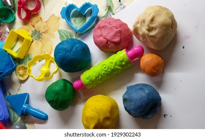 Russia, Samara, 02 March 2021. Multi-colored Dough For Modeling, Children's Plasticine With Their Own Hands, Curly Rolling Pin, Colored Molds, Children's Creativity, Play Doh. Red, Blue, Yellow, Green