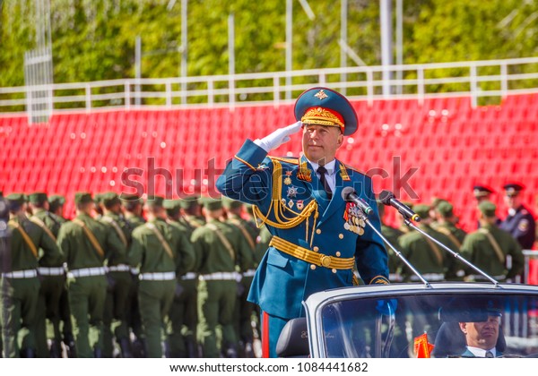 Russia, Samara, July 2016: the\
army general in parade uniforms rides his troops to the rehearsals\
of the Victory Parade in Kuybyshev Square. Text in Russian:\
tribune.