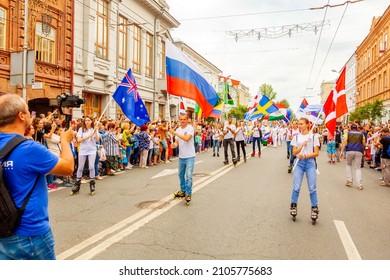 RUSSIA, SAMARA, JULY 2019: Football Fans Carry Flags Of Great Britain And Denmark And Russia During The Football Fans' March On Kuibysheva Street During The World Cup Carnival.