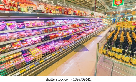 Russia, Samara, November 2018: Sale Of Sausage Products In The Hypermarket. Text In Russian: Sausages, For Grill, For A Picnic, Kupaty, Original, Production, Goods With A Minimum Markup