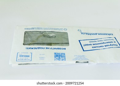 Russia, Samara, October 2020: A traffic violation notification letter lies on the table. Russian text: non-refundable, Samara, Russia, registration on the portal is required.