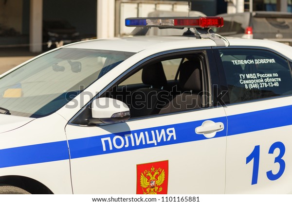 Russia,\
Samara, September 2017: Russian police patrol car, on a city street\
on a summer day. The text in Russian:\
police.
