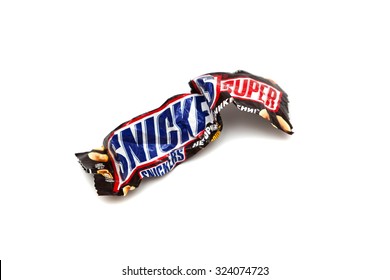 RUSSIA - SEPTEMBER 30, 2015: Recycled Crumpled Wrapper From A Snickers Super Double Chocolate Bar Made By Mars, Inc. Isolated On White Background