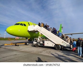 Russia. Siberia. Novosibirsk. September. 22. 2020: 
Passengers Board The Plane On The Ladder. Mobile Photo.