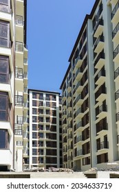 Russia, Sochi, Adler-May 05, 2019: An Unfinished Apartment Building On A Small Area Of Land. Urban Density